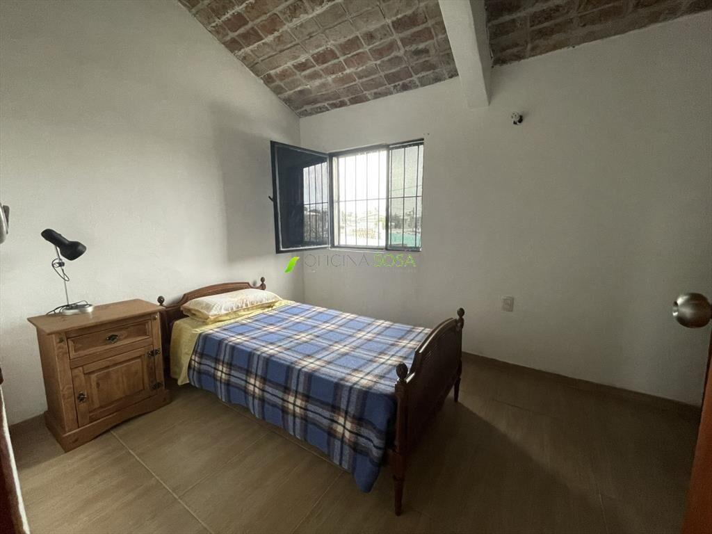 CASA EN COOPEERATIVA CON ENTRADA LATERAL DE VEHICULOS