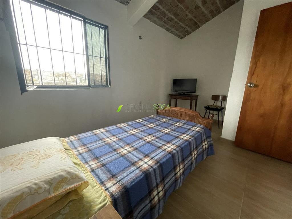 CASA EN COOPEERATIVA CON ENTRADA LATERAL DE VEHICULOS