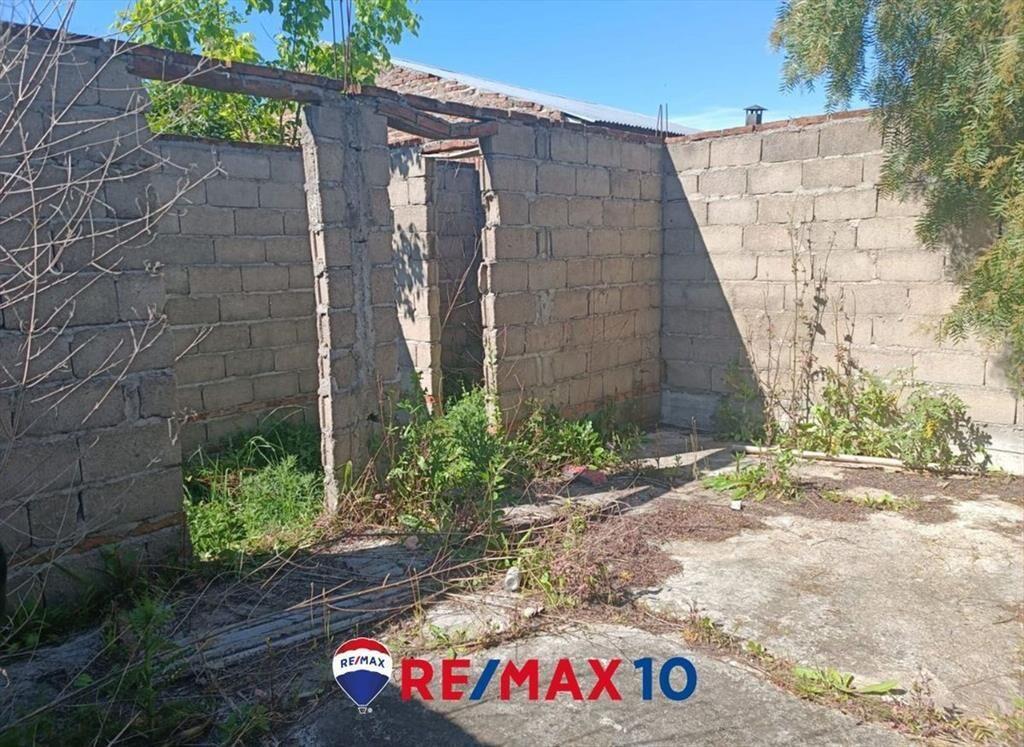 Terreno con Mejoras